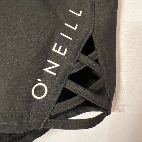 O’Neill swim short. Black. Waist approximate 16”. Cute cut out pattern each leg - Picture 2 of 6